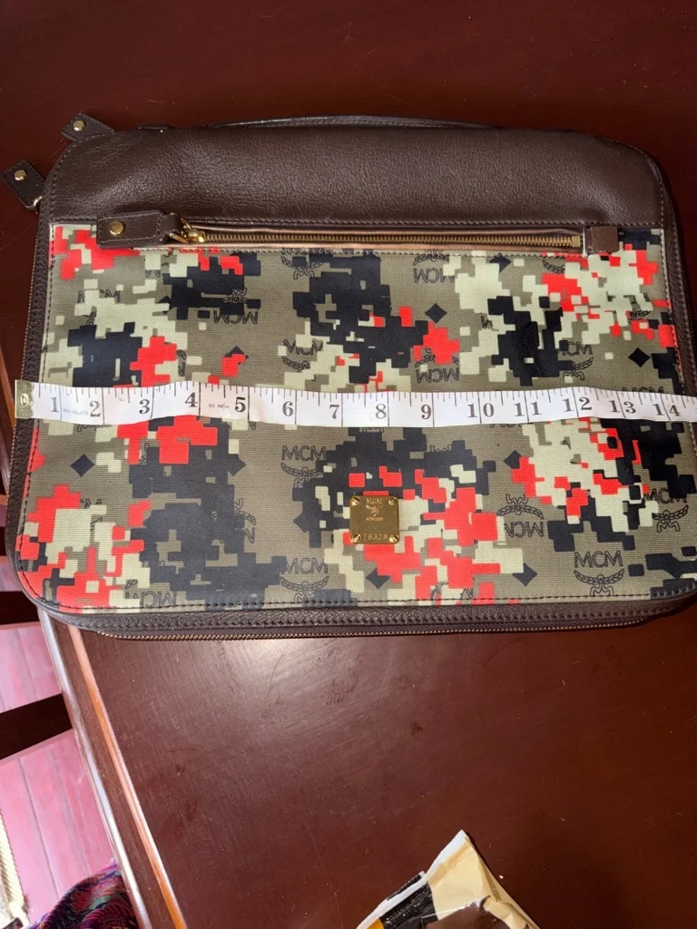 MCM laptop portfolio with brown leather trim and digital camo fabric